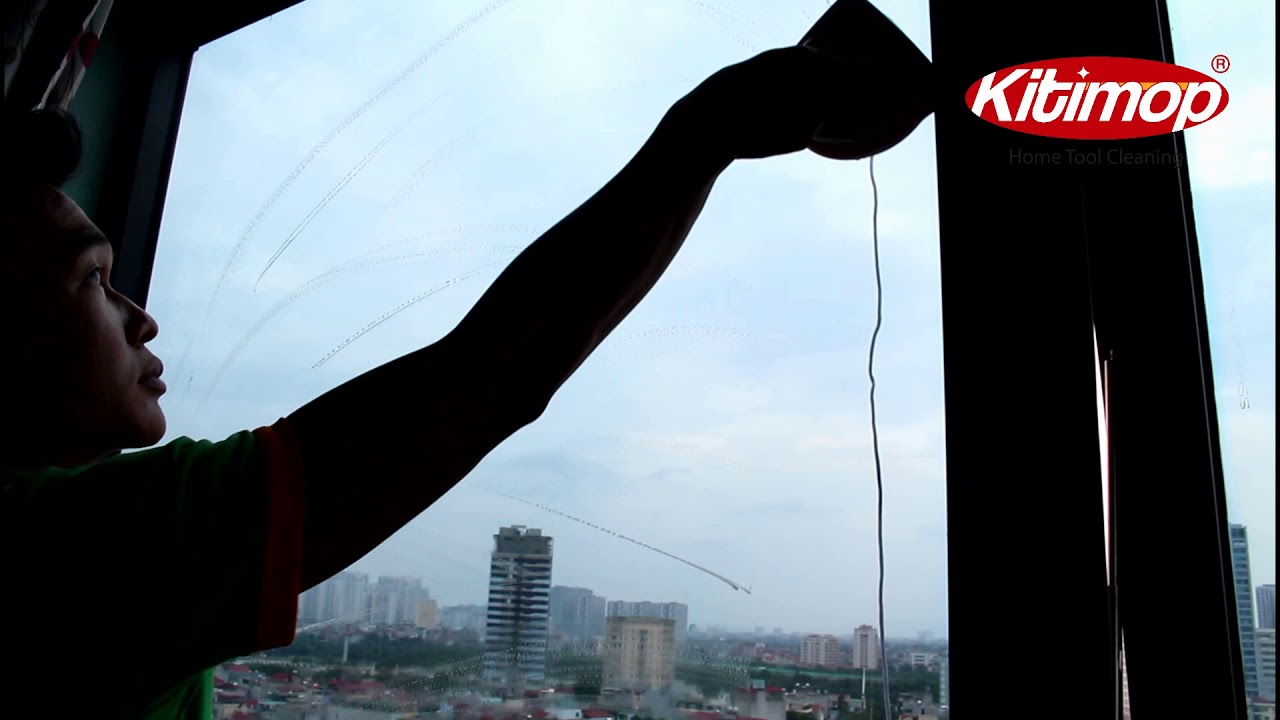 Lau cửa kính chung cư nhà cao tầng bằng bộ lau cửa kính năm châm KITIMOP